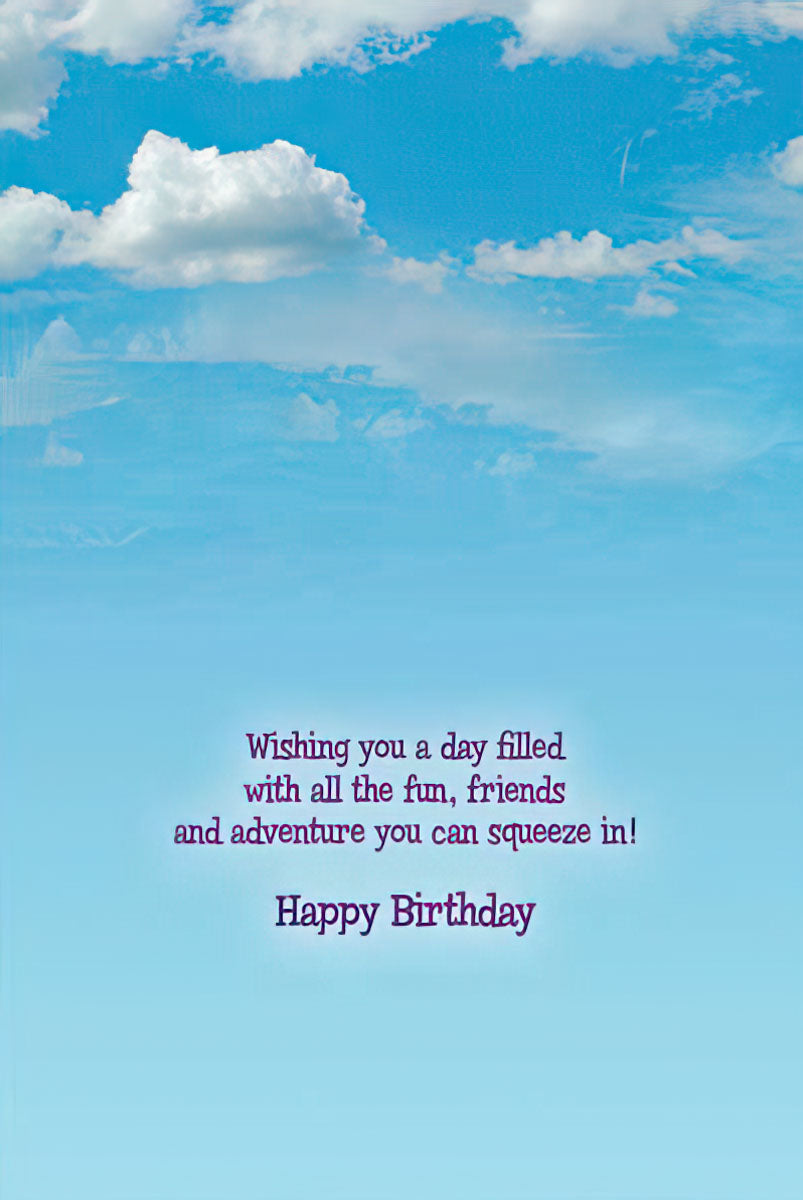 Inside of a Happy Birthday greeting card with a blue sky and clouds, featuring a cheerful birthday message.