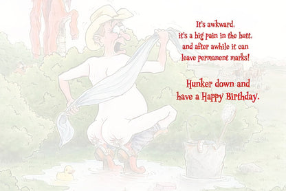 Inside of a funny birthday card with a faint image of the squatting cowboy and text about aging being a 'pain in the butt'.