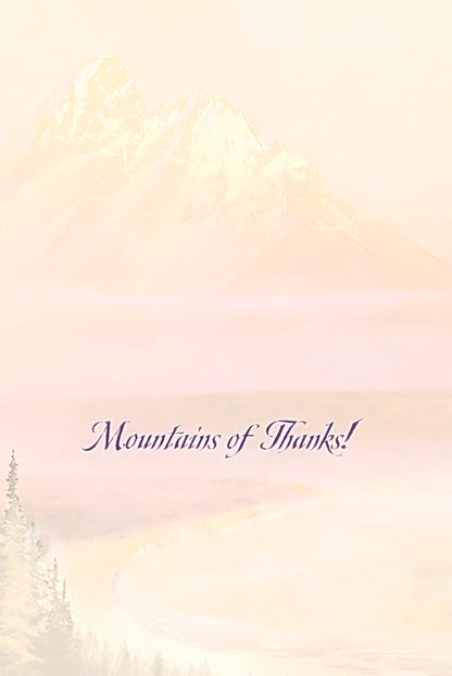The inside of a greeting card featuring a faded mountain landscape background and the elegant script text 'Mountains of Thanks!'.