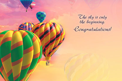 Inside of a congratulatory greeting card showing colorful hot air balloons and the message 'The sky is only the beginning. Congratulations!'