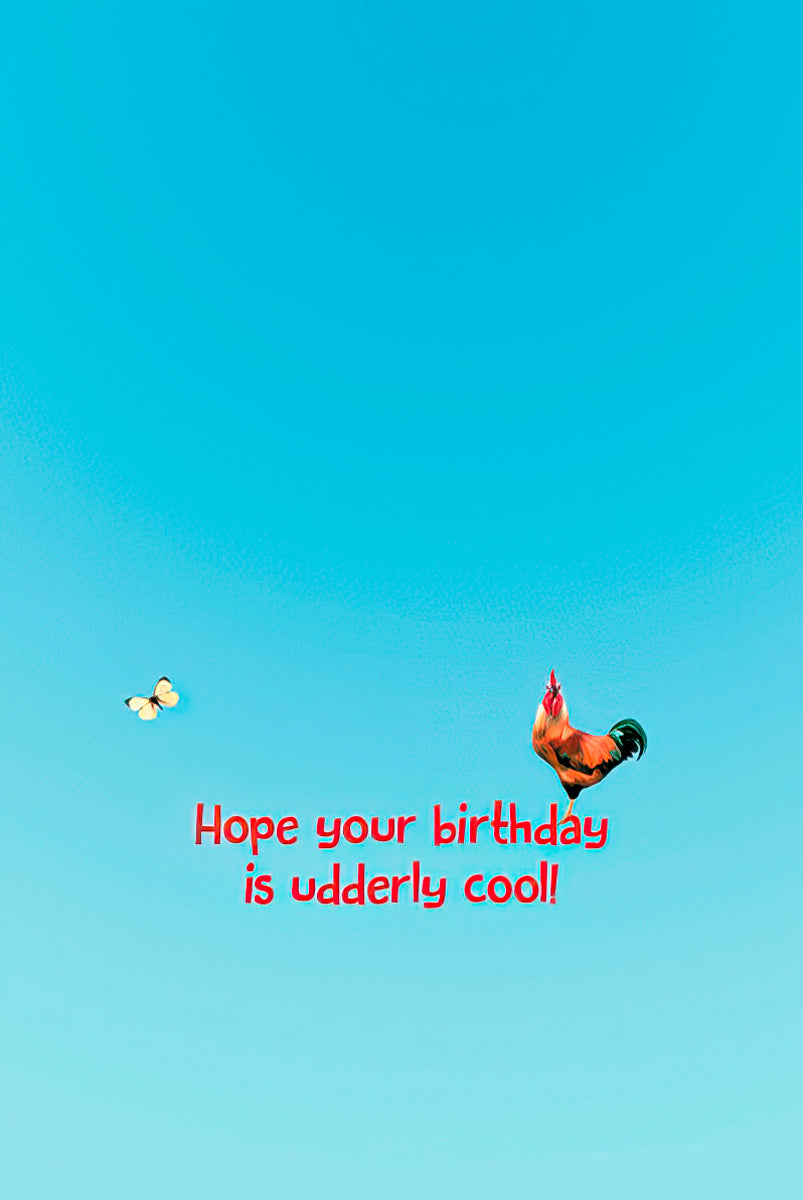 A minimalist card back featuring a flying rooster and the humorous birthday message "Hope your birthday is udderly cool!" against a blue sky.