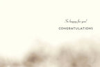 Inside of a heartfelt new baby greeting card, displaying a clean cream background with elegant script text 'So happy for you!' and bold capital letters 'CONGRATULATIONS' for an expecting couple or new parents.