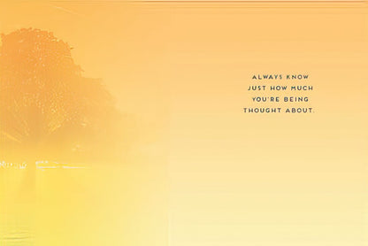 Inside of an encouraging greeting card with a soft golden glow and 'ALWAYS KNOW JUST HOW MUCH YOU'RE BEING THOUGHT ABOUT.'