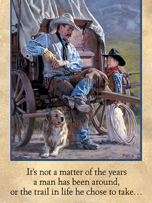 Detailed painting of a cowboy and young boy sitting on a wooden wagon with a golden retriever, set against a mountainous Western landscape.