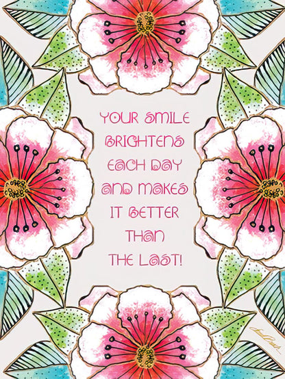 Laurel Burch card with pink flowers framing "Your smile brightens each day and makes it better than the last!".