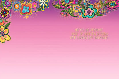 Inside of Laurel Burch anniversary card: "Here's to another year of sharing dreams and loving life together."