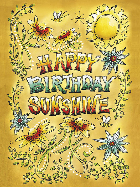 Front of a 'Happy Birthday Sunshine' card featuring a bright yellow sun, colorful flowers, green vines, and bees on a gold background.