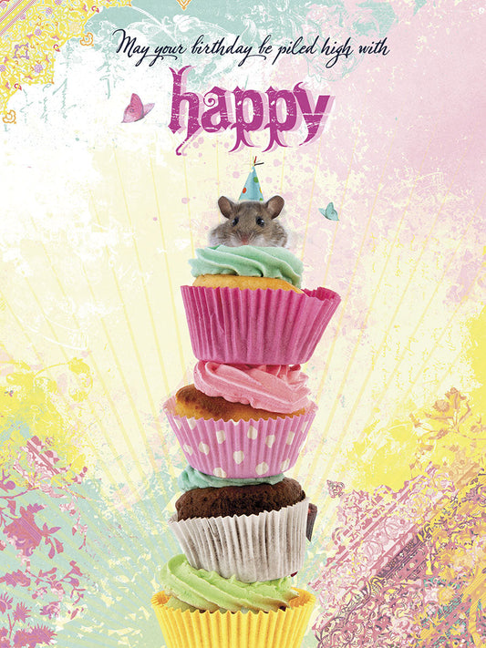 Front of a birthday card with a hamster wearing a party hat atop a tall stack of colorful cupcakes. Text: 'May your birthday be piled high with happy.'