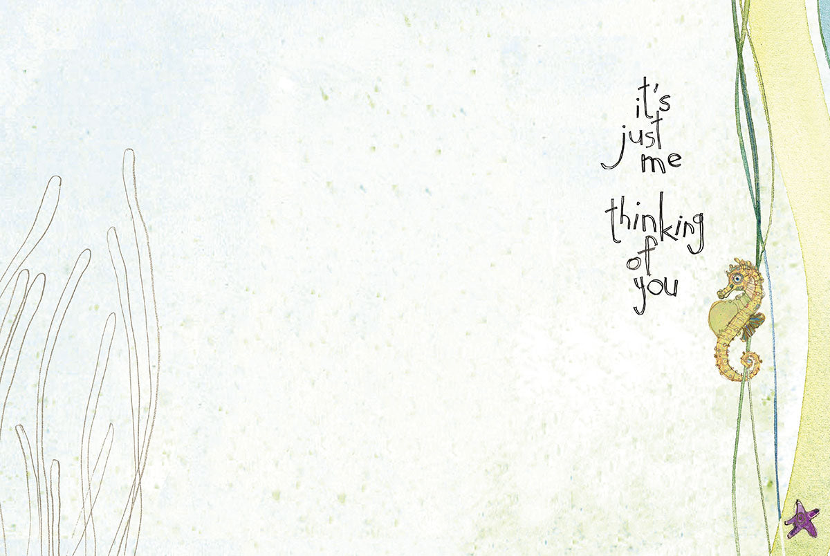 Inside of a greeting card, blank space for message, with a whimsical seahorse and starfish, and text 'it's just me thinking of you'.