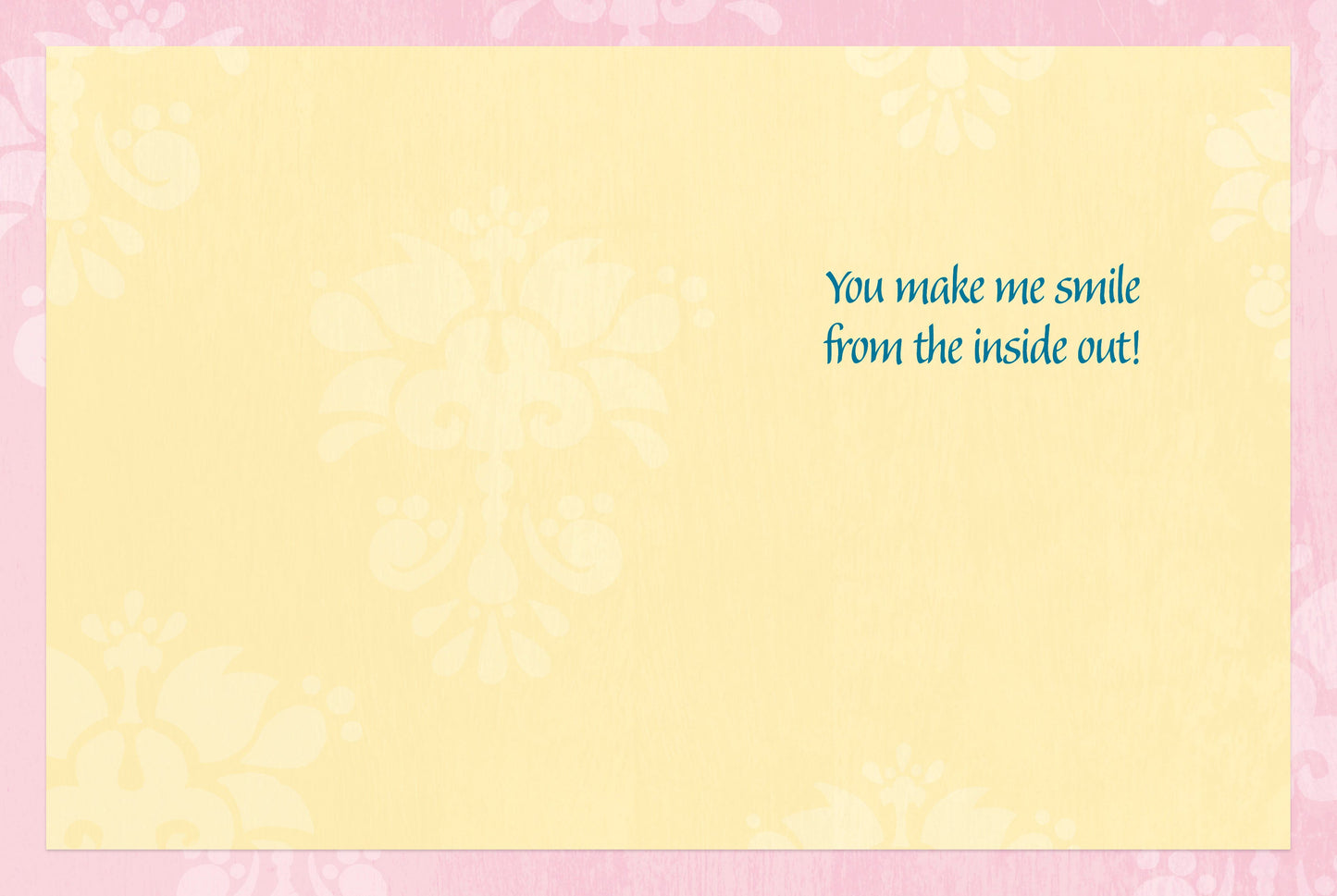 Inside of greeting card with a light yellow background, pink border, and text that reads 'You make me smile from the inside out!'