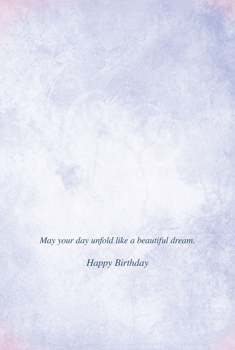 Inside of a birthday card with the message 'May your day unfold like a beautiful dream. Happy Birthday' on a light textured background.