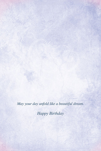Inside of a birthday card with the message 'May your day unfold like a beautiful dream. Happy Birthday' on a light textured background.