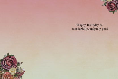 Open birthday card displaying 'Happy Birthday to wonderfully, uniquely you!' with floral accents.