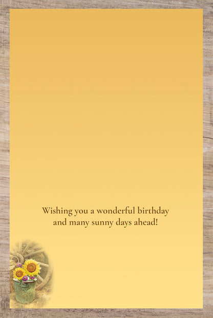 Inside of a birthday card with a warm message 'Wishing you a wonderful birthday and many sunny days ahead!'