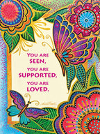 Vibrant greeting card front with two colorful butterflies, intricate gold-accented floral mandalas, and text 'YOU ARE SEEN, YOU ARE SUPPORTED, YOU ARE LOVED' for a heartfelt message.