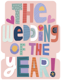 Front of a playful, colorful greeting card for a marriage celebration, featuring bold, patterned letters spelling 'THE WEDDING OF THE YEAR!' on a pale pink background with small heart accents.