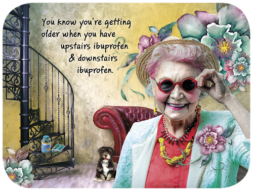 Humorous greeting card featuring a smiling elderly woman in sunglasses and hat, surrounded by watercolor flowers, with the witty text 'You know you're getting older when you have upstairs ibuprofen & downstairs ibuprofen.' A small puppy sits by a spiral staircase.