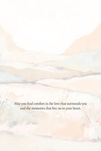 Inside of a heartfelt comfort greeting card with a subtle, abstract desert background and the printed message 'May you find comfort in the love that surrounds you and the memories that live on in your heart.'.