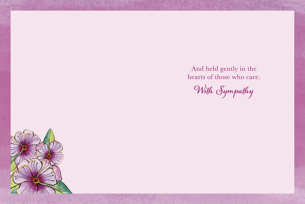 Inside view of a sympathy card showing pink watercolor texture and a small floral design with 'With Sympathy' message.