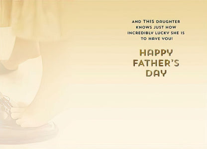 Inside of a Fathers Day card with text 'AND THIS DAUGHTER KNOWS JUST HOW INCREDIBLY LUCKY SHE IS TO HAVE YOU! HAPPY FATHER'S DAY' and faint feet image.