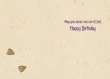 Inside of a Maggie Mae card with textured background and text 'May you never run out of fun! Happy Birthday'.