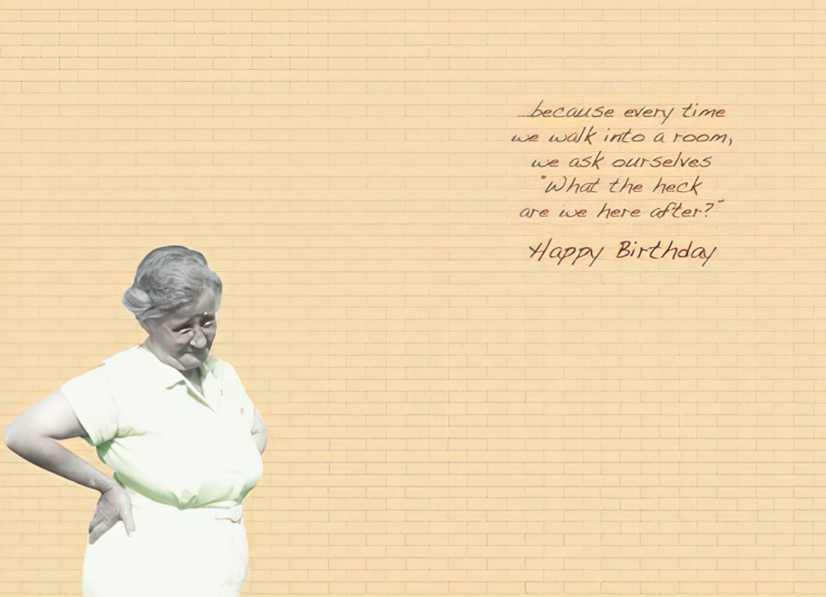 Inside of a Maggie Mae card with brick wall background and text '...we ask ourselves 'What the heck are we here after?' Happy Birthday'.