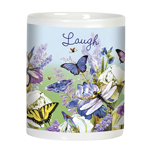 Side view of a white ceramic mug with 'Laugh' written on it, decorated with blue butterflies, dragonflies, and blooming purple and white iris flowers against a light blue and green background.