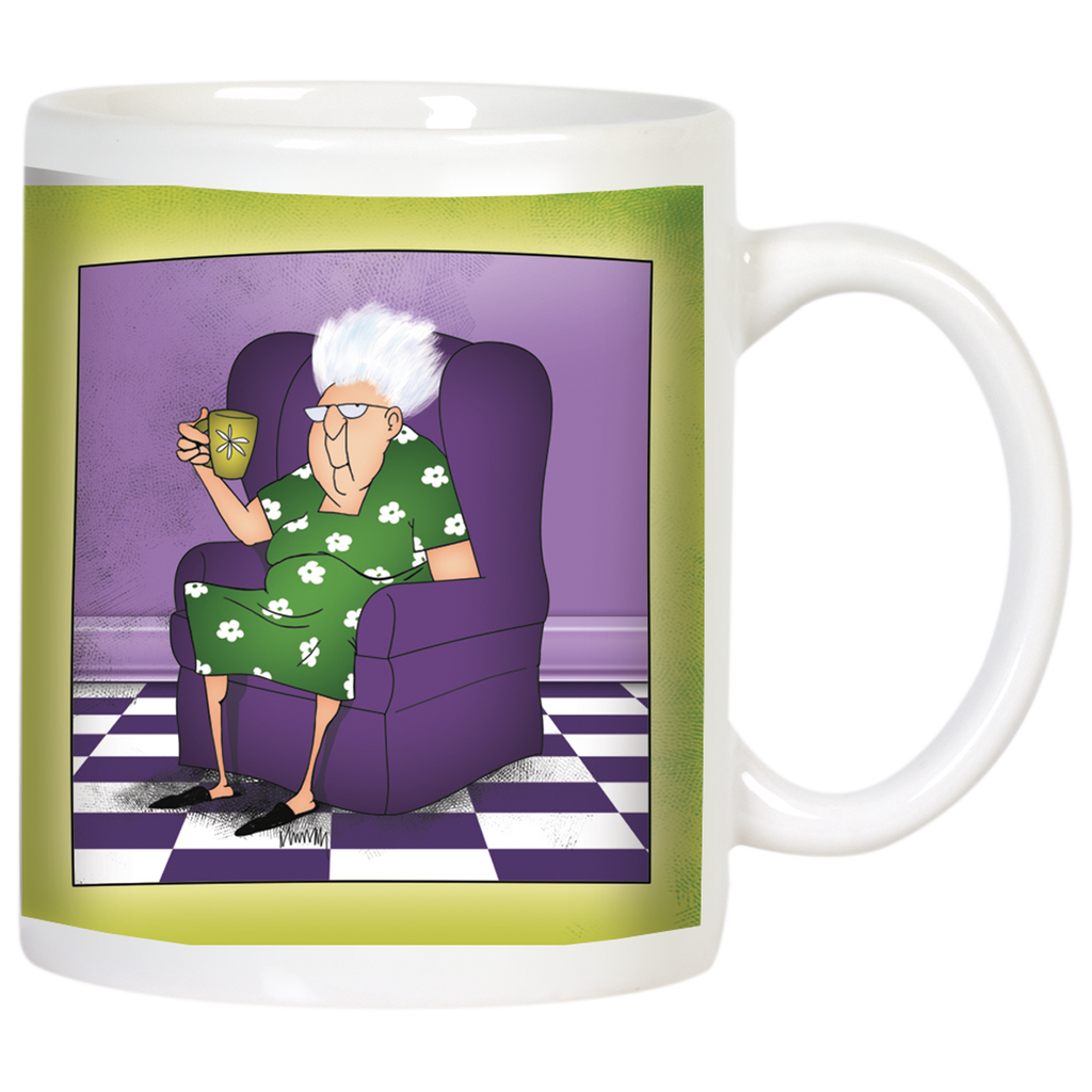 Front view of a white ceramic mug featuring a cartoon illustration of a sassy elderly woman with white hair and glasses, wearing a green floral dress, relaxing in a purple armchair with a patterned green cup in hand. The background depicts a purple wall and a black and white checkered floor, bordered by a vibrant green band around the mug. Perfect for a funny grandparent gift.