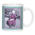 White ceramic mug featuring a vintage-style black and white photo of a smiling elderly woman in a dress sitting outdoors, framed by a teal border.