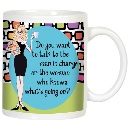 White ceramic coffee mug with a funny Sassy Boss Lady cartoon and a retro geometric pattern. Features a blonde woman in a black dress with the text: 'Do you want to talk to the man in charge or the woman who knows what's going on?'