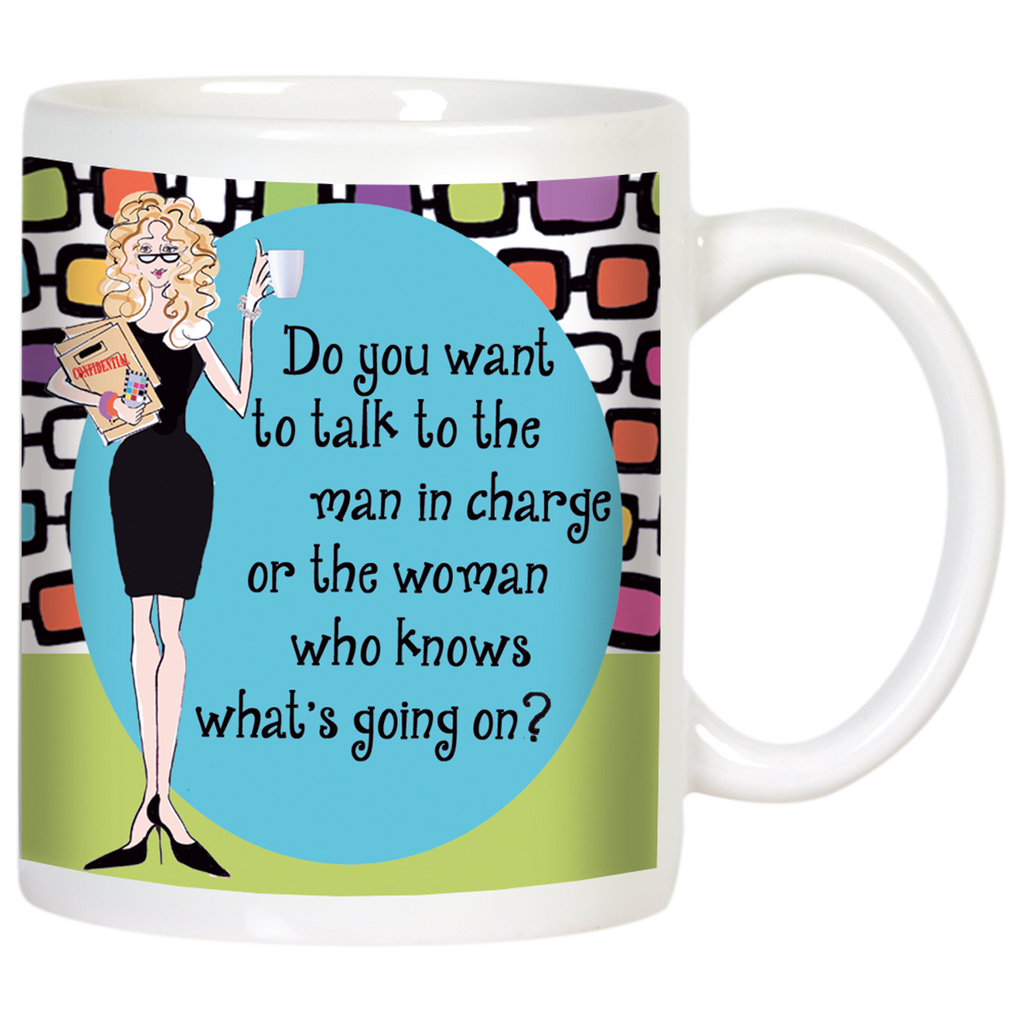Front view of a white ceramic coffee mug with a sassy blonde woman cartoon illustration in a black dress, holding coffee and a folder. Features the quote: 'Do you want to talk to the man in charge or the woman who knows what's going on?' on a blue oval, with a retro colorful geometric background.