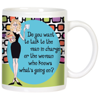 Front view of a white ceramic coffee mug with a sassy blonde woman cartoon illustration in a black dress, holding coffee and a folder. Features the quote: 'Do you want to talk to the man in charge or the woman who knows what's going on?' on a blue oval, with a retro colorful geometric background.
