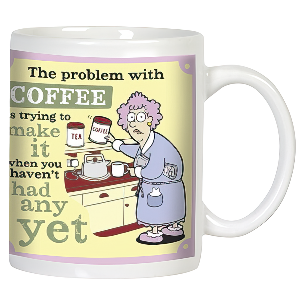 Front view of a funny white ceramic coffee mug featuring a confused woman in a robe struggling to make coffee before her first sip, with the humorous text 'The problem with COFFEE is trying to make it when you haven't had any yet.' Perfect for coffee lovers.