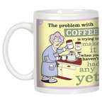 Angled view of a humorous coffee mug displaying a cartoon character attempting to brew coffee with difficulty, illustrating the relatable struggle of 'The problem with COFFEE' before caffeine kicks in. Ideal gift mug.