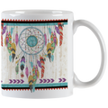 White ceramic mug featuring a vibrant Native American inspired dreamcatcher design with colorful feathers and an artisan turquoise center, handle visible.