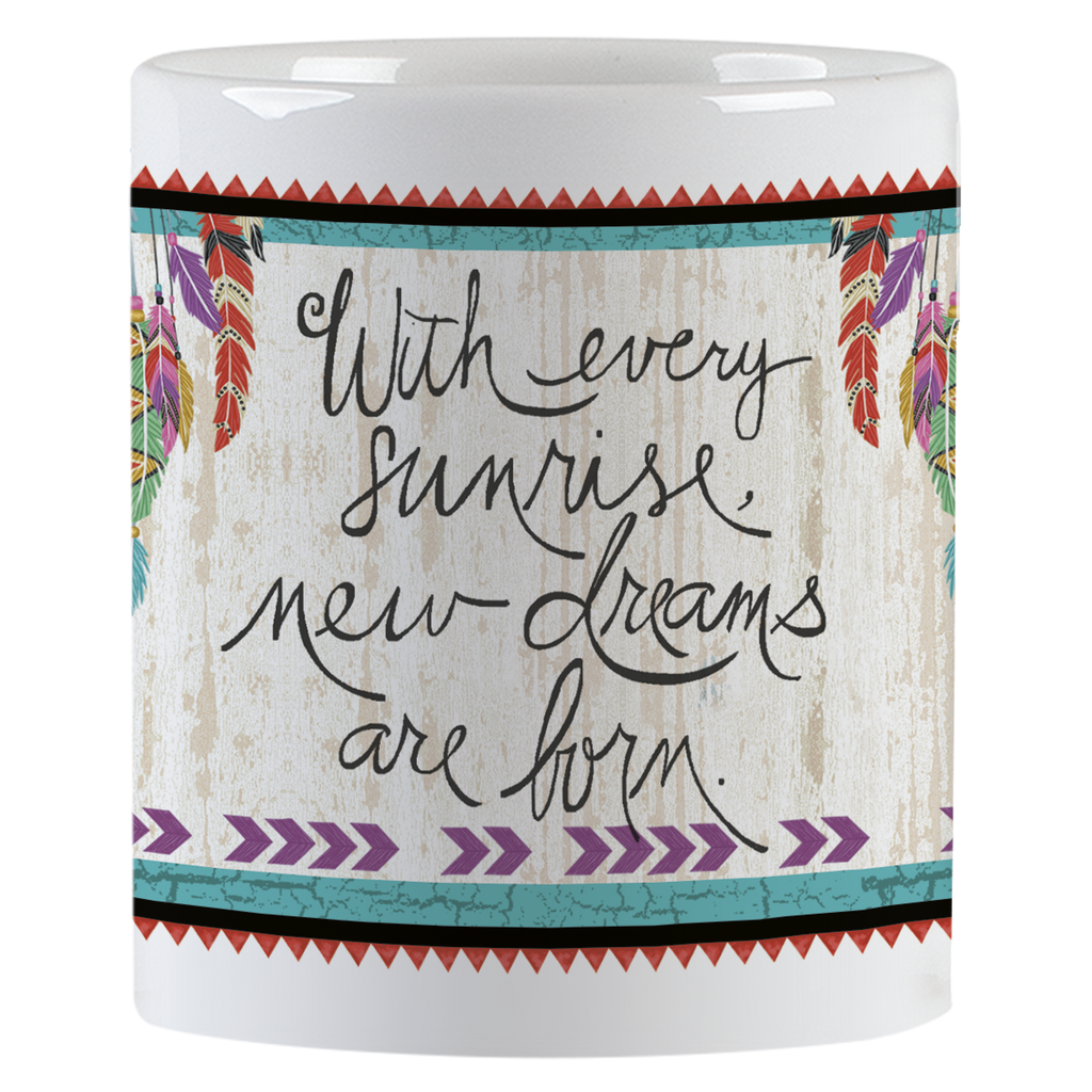 Inspirational white ceramic mug with the quote "With every sunrise, new dreams are born." in elegant script on a rustic wood-grain background with feather details.