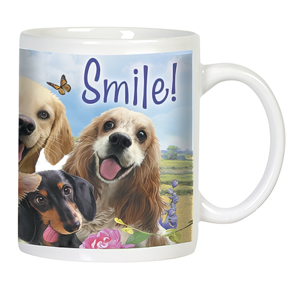 Front view of a white ceramic mug with "Smile!" text, featuring a golden retriever, cocker spaniel, and dachshund with happy expressions amidst flowers and a butterfly.