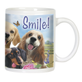 Front view of a white ceramic mug with "Smile!" text, featuring a golden retriever, cocker spaniel, and dachshund with happy expressions amidst flowers and a butterfly.