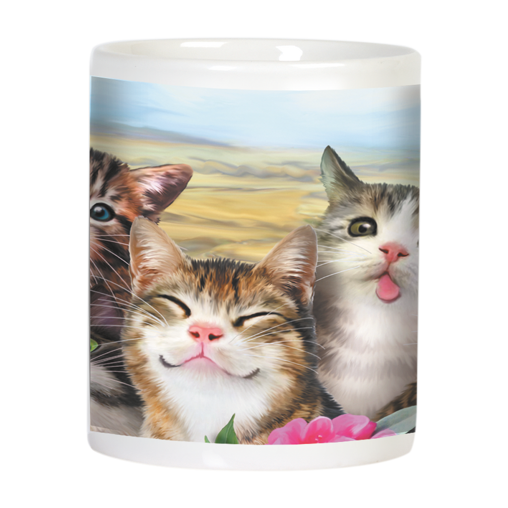 Close-up of a white mug depicting three cute kittens with varied expressions, including a smiling one and one with its tongue out, amidst colorful flowers.