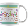 White ceramic mug with 'What happens at grandma's stays at grandma's' text in colorful, playful fonts with paint splatters and handprints, perfect funny gift for grandmothers.