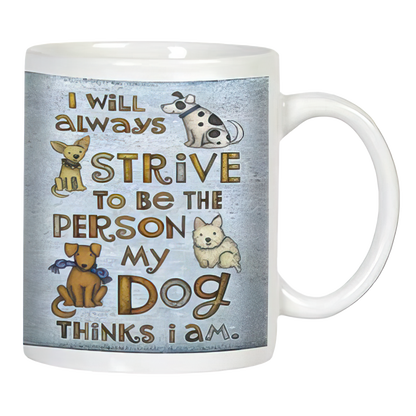 White ceramic mug with "I will always strive to be the person my dog thinks I am" text and cute cartoon dogs on a rustic background.
