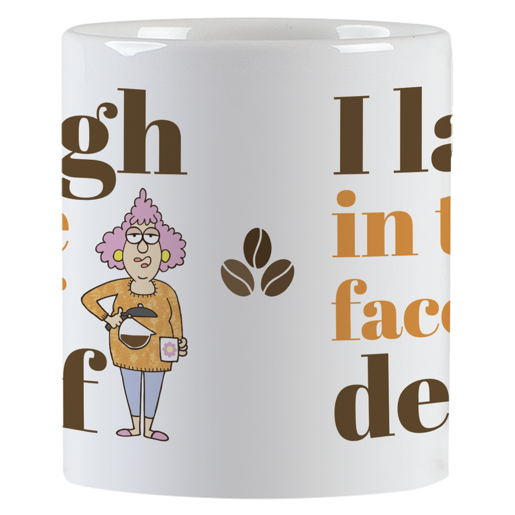 Side view of the 'I laugh in the face of decaf' white coffee mug, highlighting the cartoon character with a coffee pot, coffee bean graphics, and parts of the humorous text.