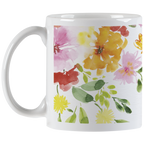 Back view of a white ceramic mug showcasing a full wrap-around watercolor floral pattern with pink, yellow, orange, and red flowers and green leaves, with the handle on the left.