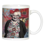 Funny white ceramic mug with an illustration of a smiling senior woman wearing glasses and a red bow, featuring 'THE SENILITY PRAYER' partially visible, perfect for grandparent humor.