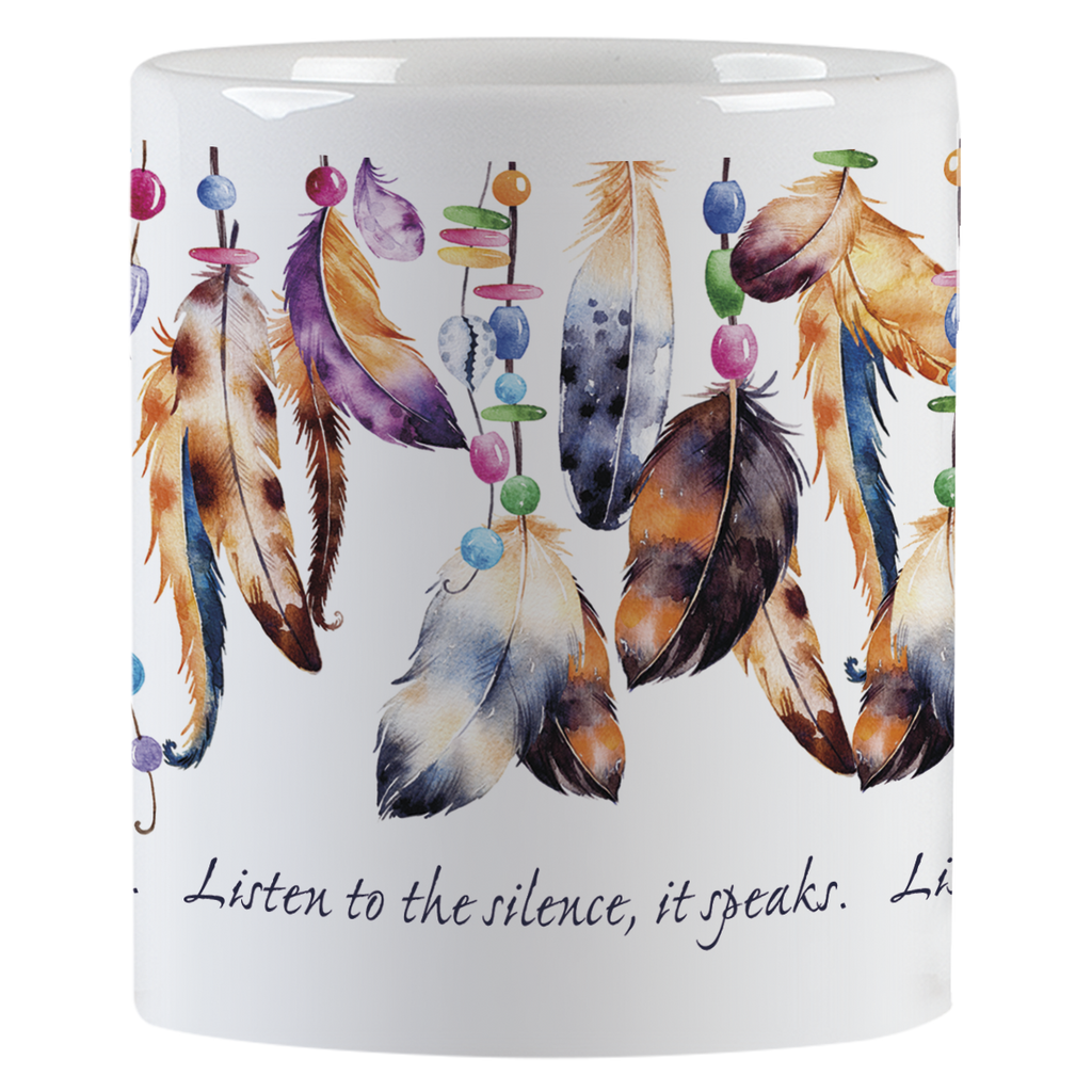 Side view of a white ceramic mug, displaying a continuous wraparound design of diverse feathers and small, colorful beads. The feathers are in shades of brown, blue, purple, and orange, with beads in pink, green, and blue. The text 'Listen to the silence, it speaks.' is printed below the artwork.