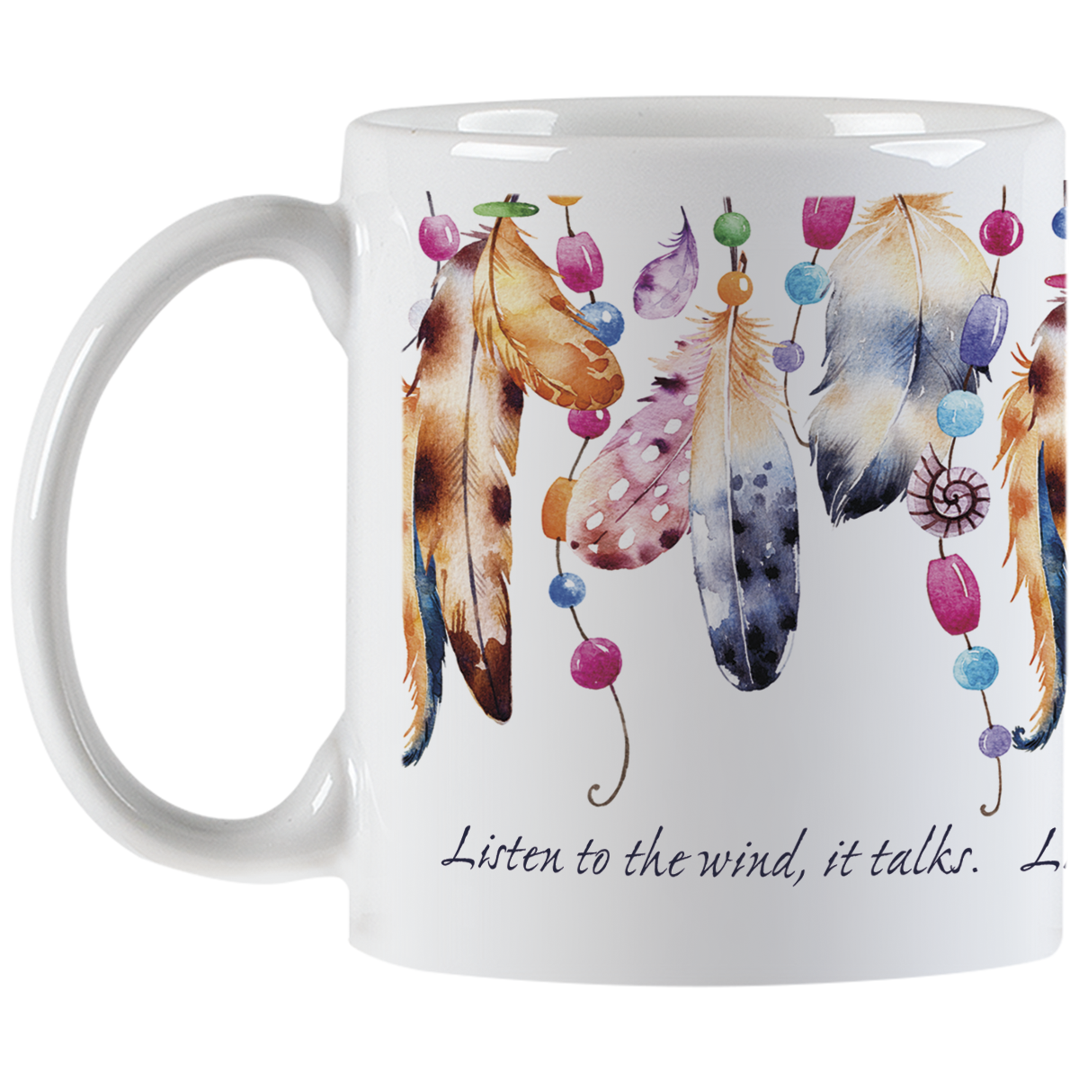 White ceramic coffee mug viewed from the left side with its handle. The mug is adorned with an intricate pattern of watercolor feathers and bright beads, suggesting a spiritual or bohemian theme. The inspirational message 'Listen to the wind, it talks.' is elegantly scripted on the mug's lower portion.