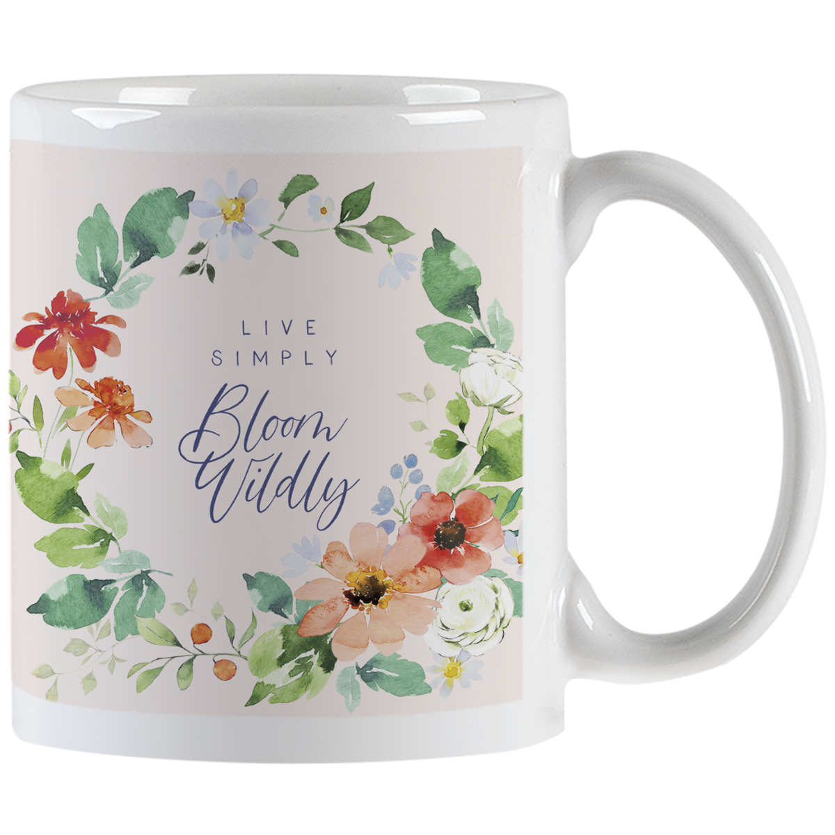 White ceramic mug with colorful watercolor floral wreath design and 'Live Simply Bloom Wildly' text on a light pink background.