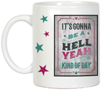 Back view of the white ceramic 'Hell Yeah' mug, with the handle on the left, clearly displaying the full vibrant quote 'IT'S GONNA BE A HELL YEAH KIND OF DAY' on a rustic wooden texture, complemented by decorative stars.