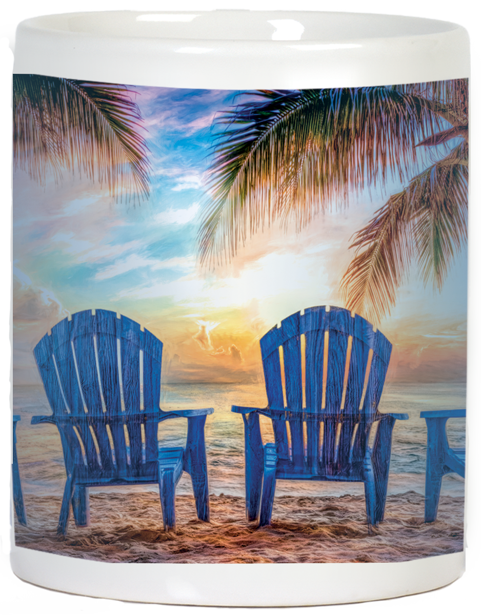 Full wrap-around view of an inspirational white ceramic mug showcasing a breathtaking beach sunset. Two empty blue Adirondack chairs face the vibrant ocean under palm fronds. Perfect for relaxation and positive vibes.