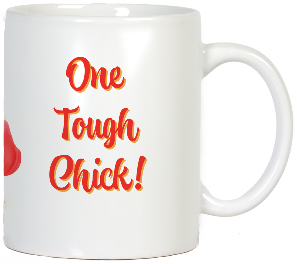 Side view of a white ceramic coffee mug with the phrase "One Tough Chick!" in bold red and orange lettering, emphasizing the empowering message.